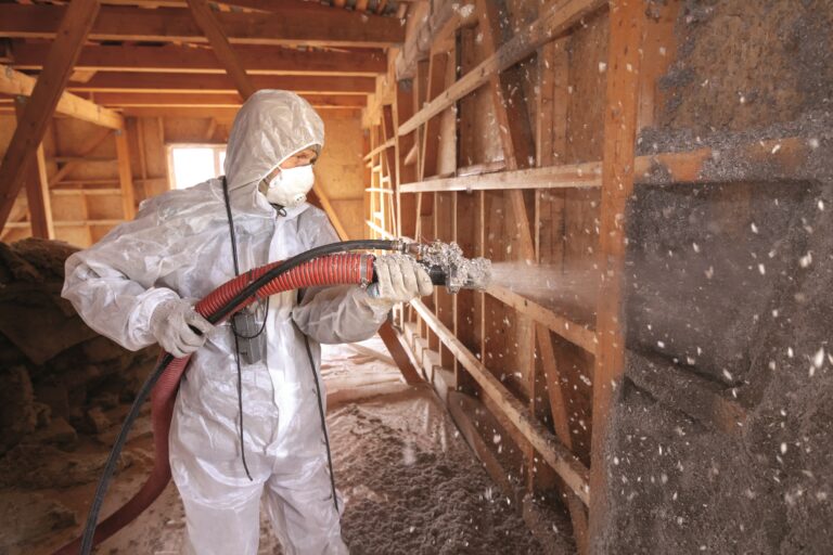 Spraying,Cellulose,Insulation,On,The,Wall